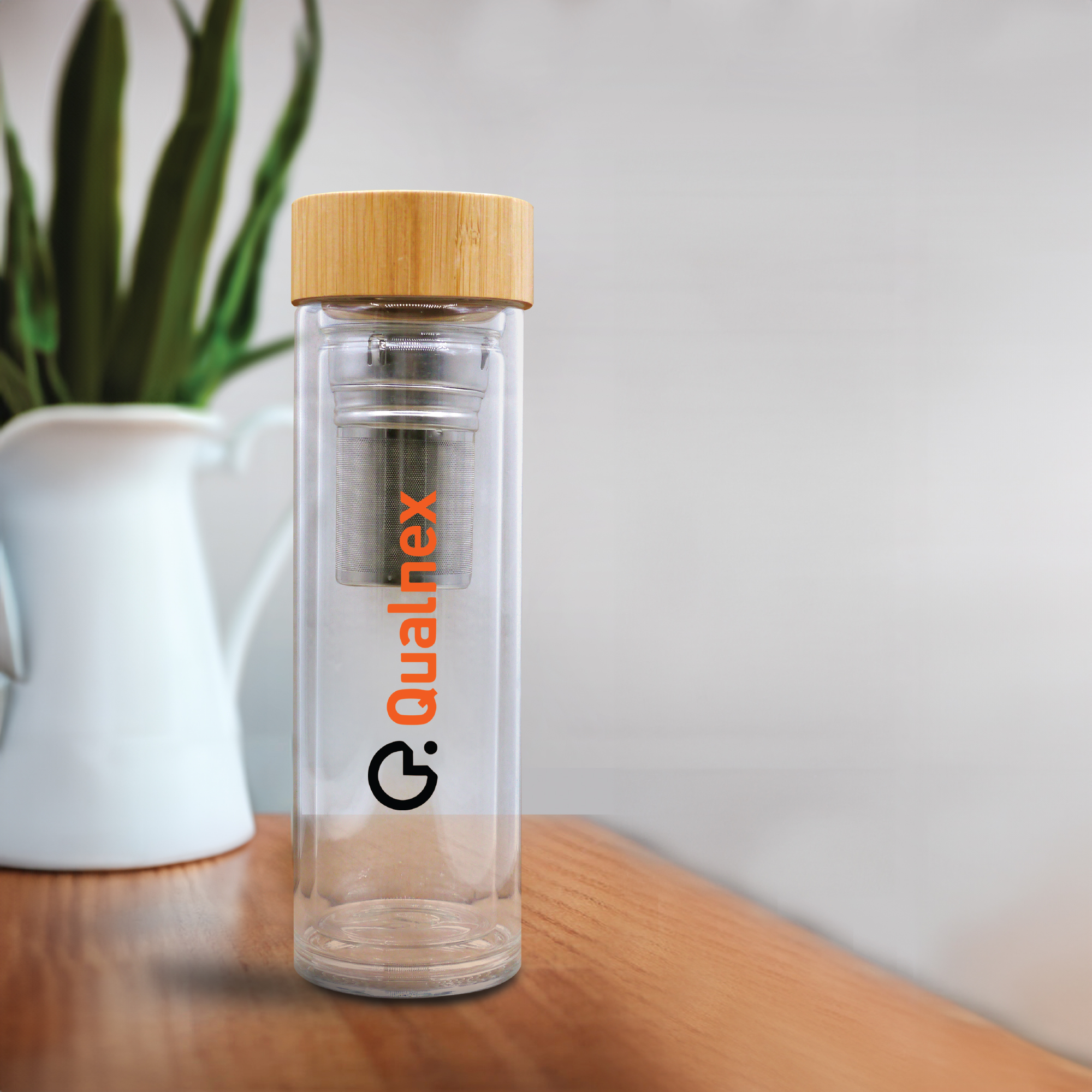 Glass & Bamboo Flask: Stylish eco-friendly beverage container with bamboo accents.